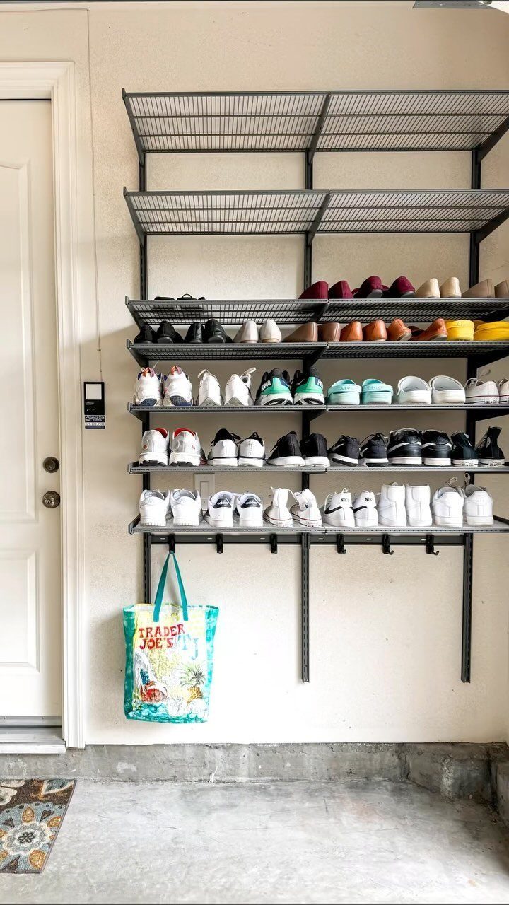 9 Garage Storage Shoes For Any Budget, Wall to Floor 4 Black wire shelving unit mounted on a wall holding many rows of various shoes.