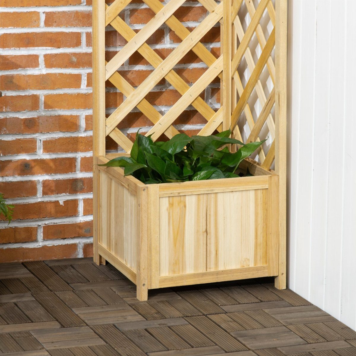 14 Raised Garden Bed Ideas for Cedar, Stone, Metal & More 2 Wooden planter box with a tall lattice trellis and green plants on a tiled patio.