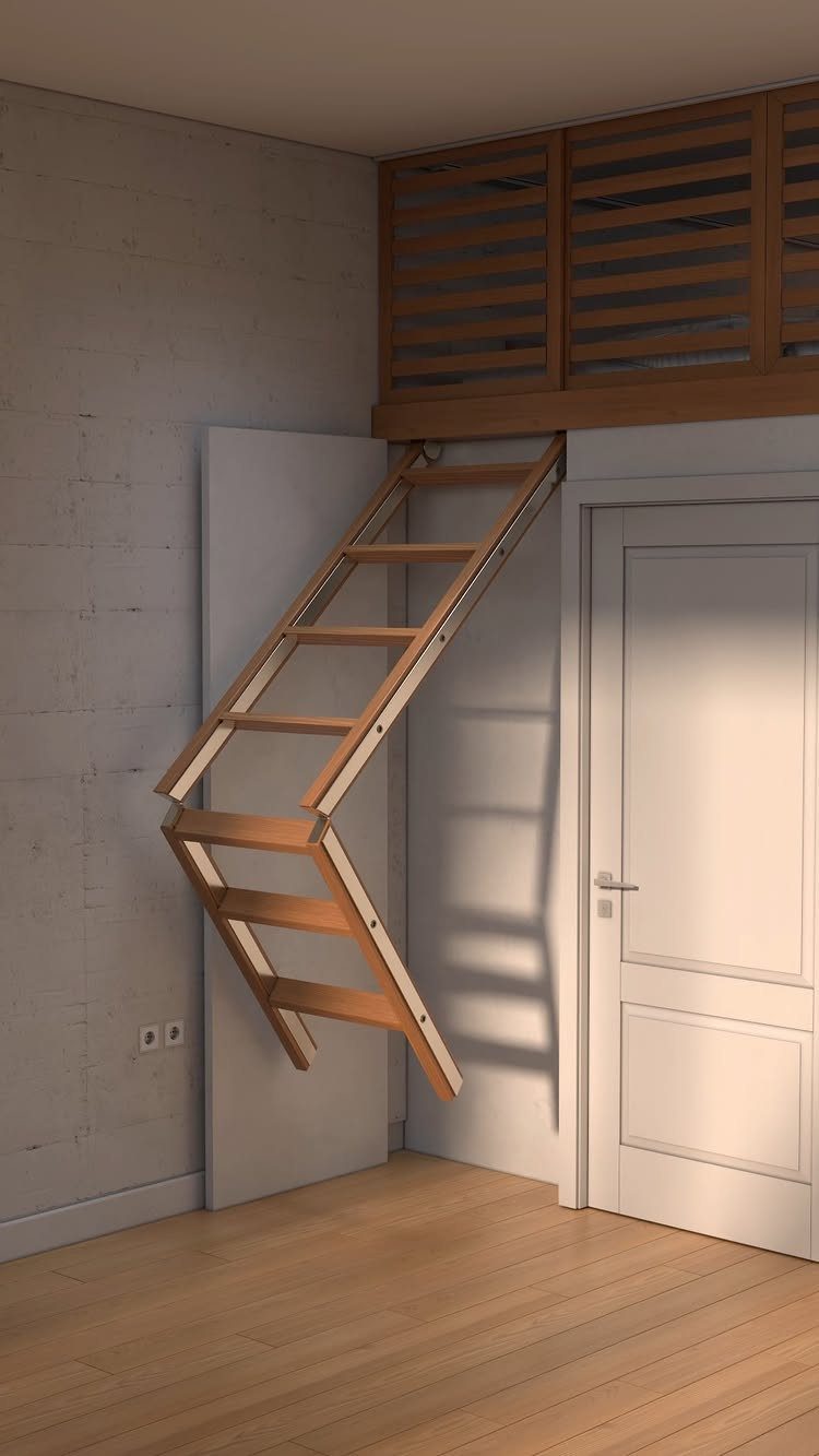 A wooden foldable ladder staircase partially extended in a modern room with light wood floors.